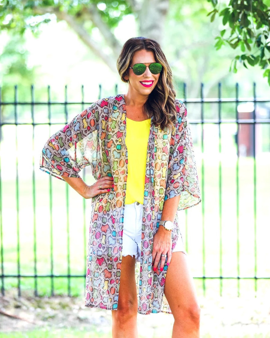 open front kimono made of lightweight material with side slits on a multi-colored snakeskin print fabric