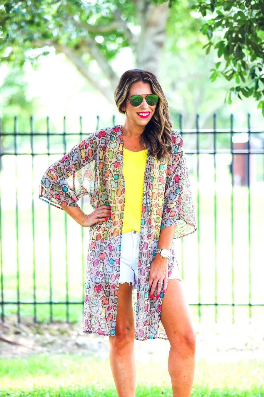 open front kimono made of lightweight material with side slits on a multi-colored snakeskin print fabric