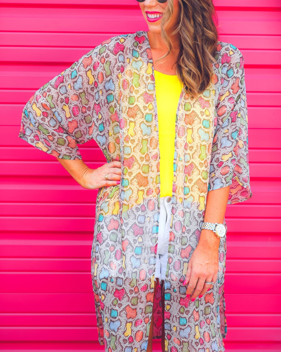 lightweight material, multi-colored snakeskin print, and side slits