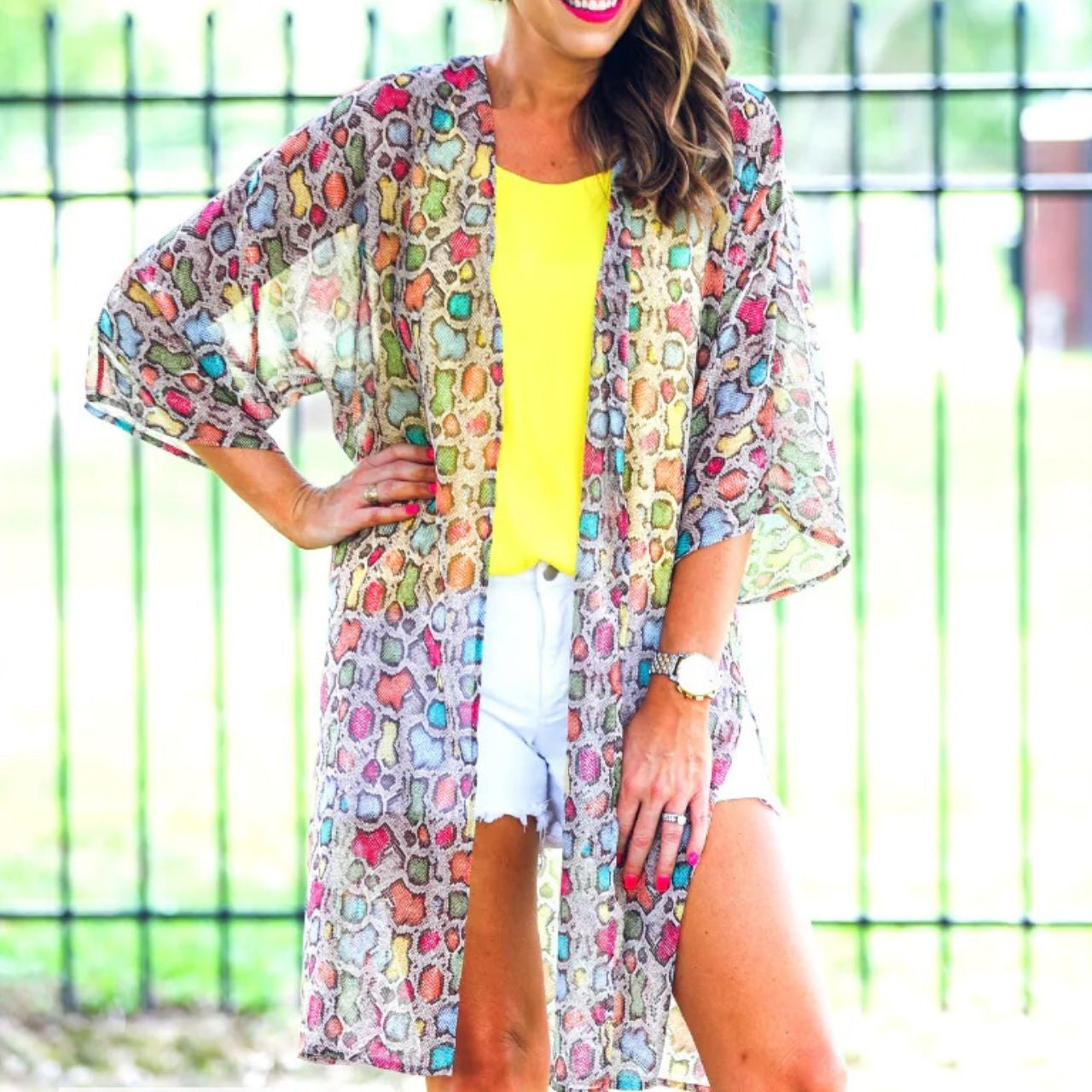 open front kimono made of lightweight material with side slits on a multi-colored snakeskin print fabric