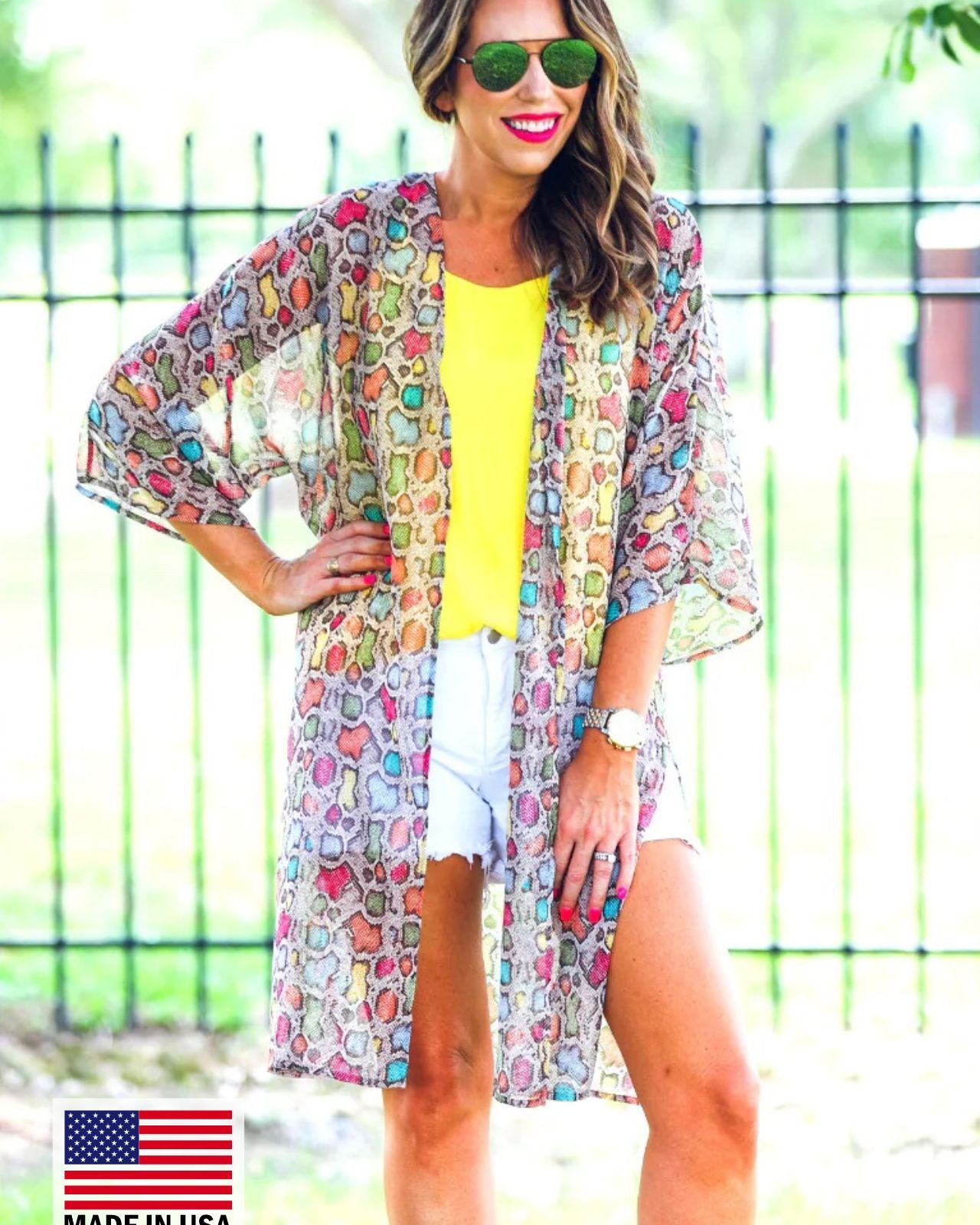 open front kimono made of lightweight material with side slits on a multi-colored snakeskin print fabric