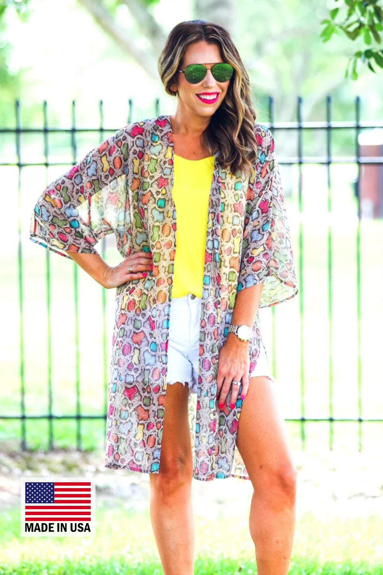 open front kimono made of lightweight material with side slits on a multi-colored snakeskin print fabric