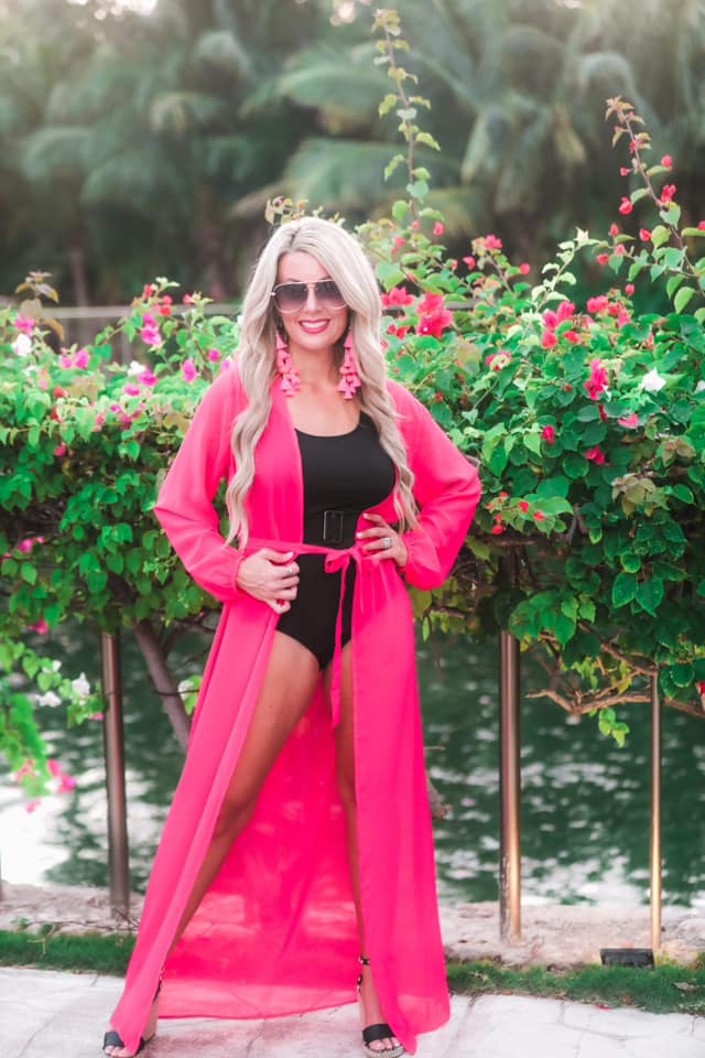 solid pink ultra long coverup made of lightweight, sheer material with an elastic wrist band and a removable tie