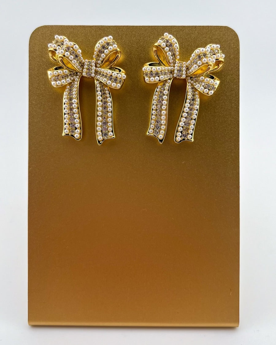 high-quality gold bow post stud earrings with rhinestones and pearl accents and a comfort earring back in gold