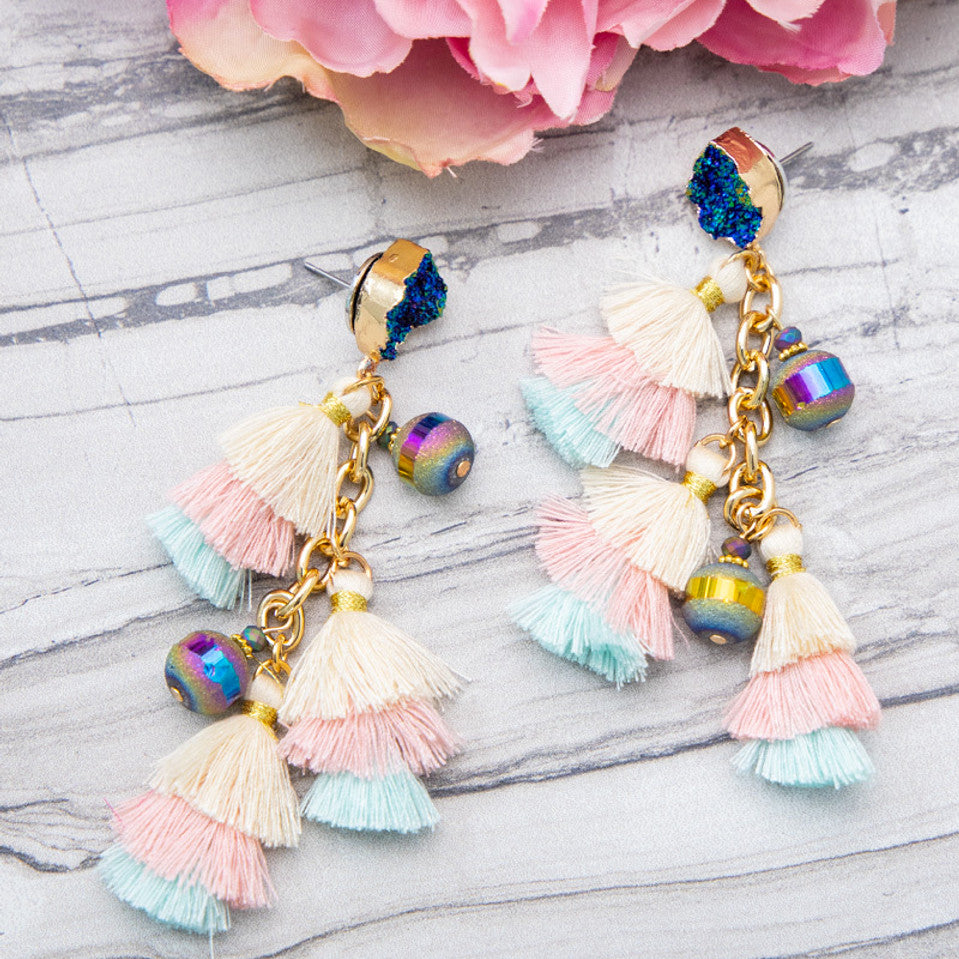 ocean-inspired tassel earrings with layered pastel fringe, iridescent beads, and deep blue-druzy style studs on gold chain drops with comfort replacement backs and gold-tone plastic disk stopper