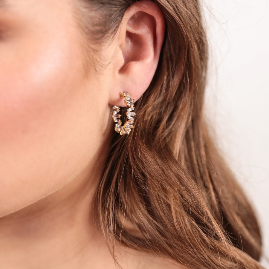 gold-plated rhinestone hoop stud earring with a comfort back earring and plastic disc stopper in gold