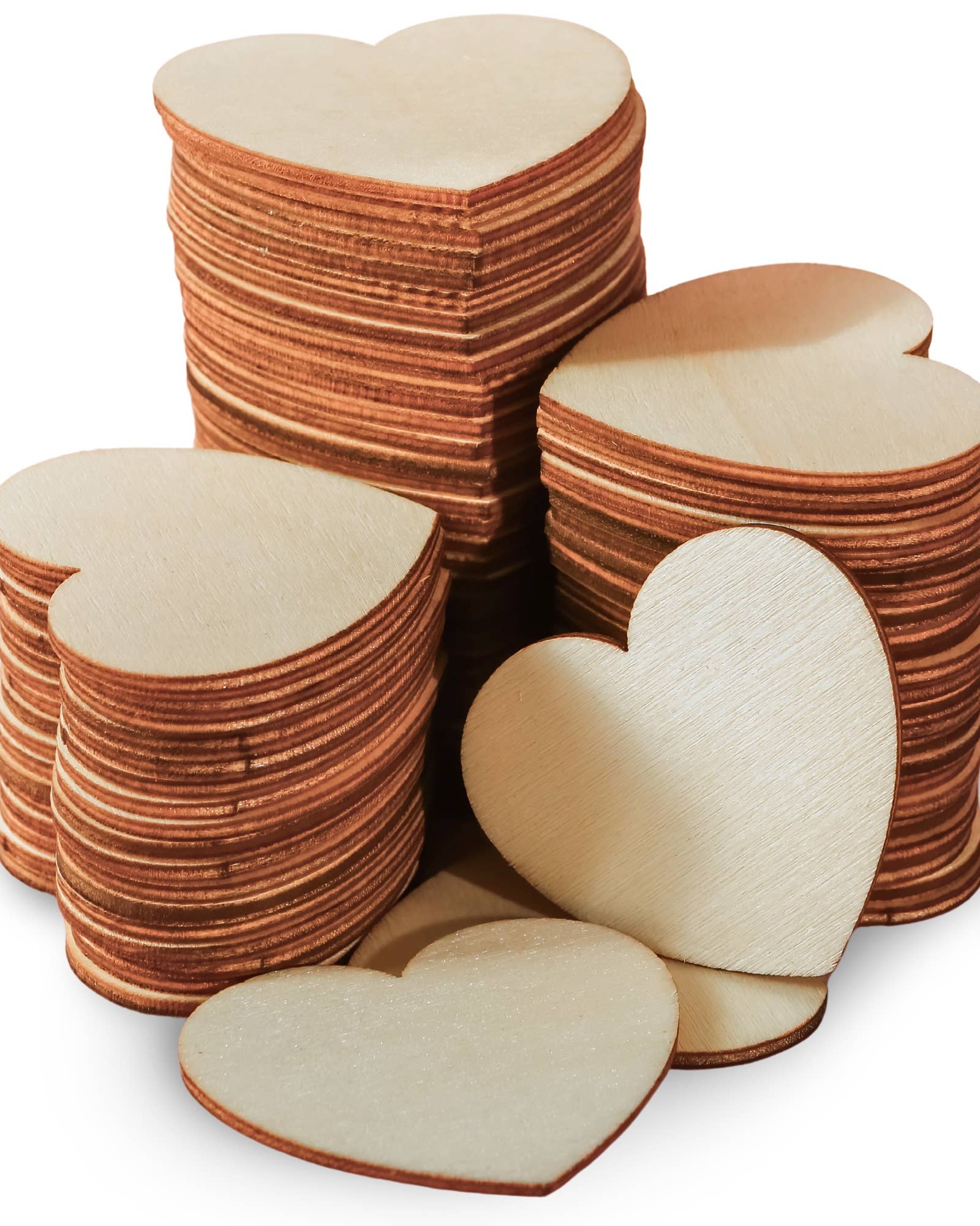 Stacks of heart-shaped wooden cutouts on a white background