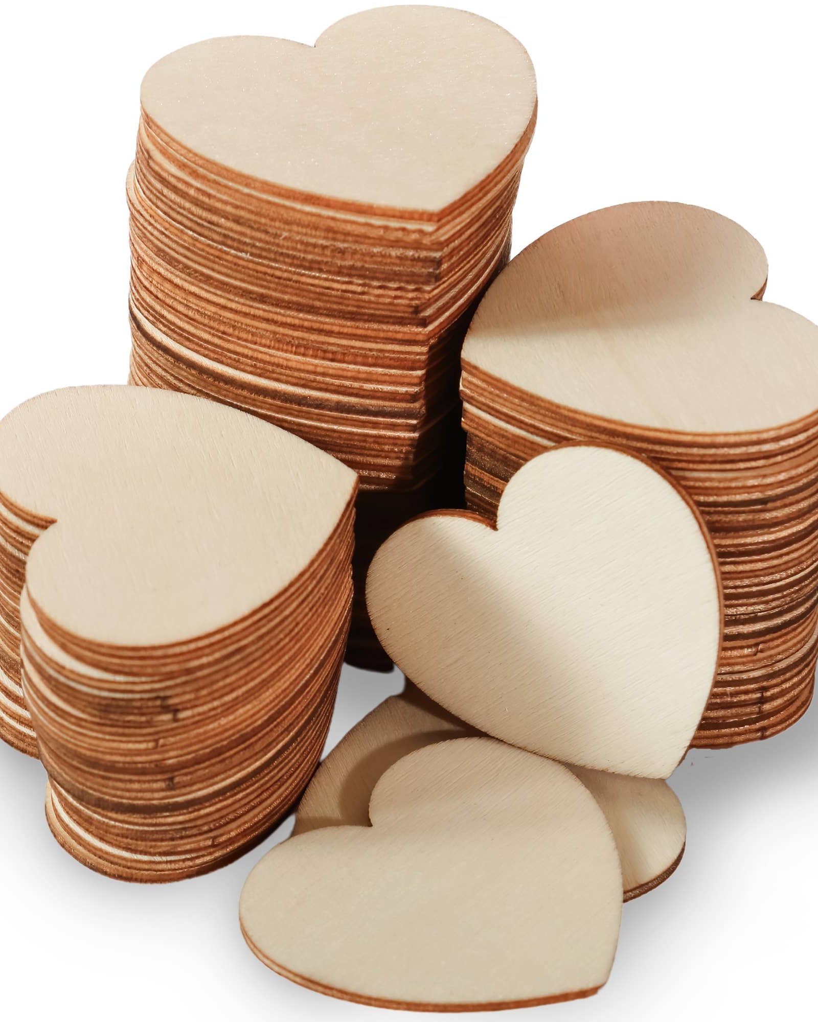 Stack of wooden heart shapes on a white background