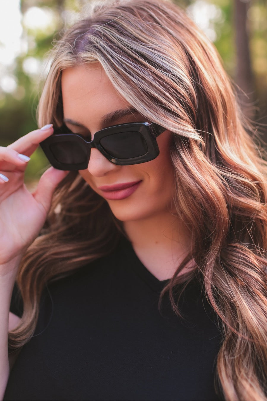 black chunky rectangular sunglasses with thick frames, tinted lenses, smooth finish, UV protection, and brand detail (on both the temple and the complimentary black pouch)