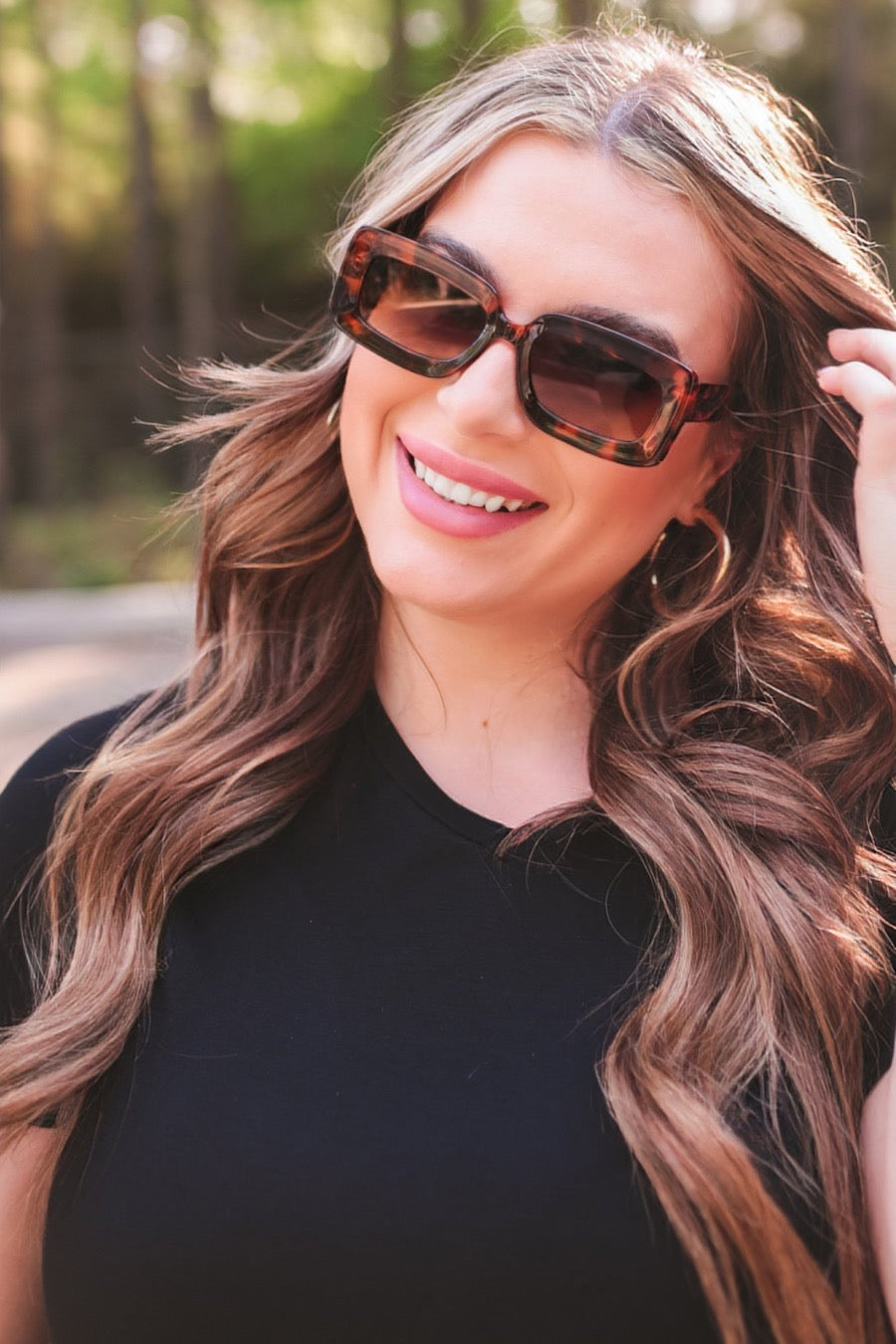 brown chunky rectangular sunglasses with thick frames, tinted lenses, smooth finish, UV protection, and brand detail (on both the temple and the complimentary black pouch)