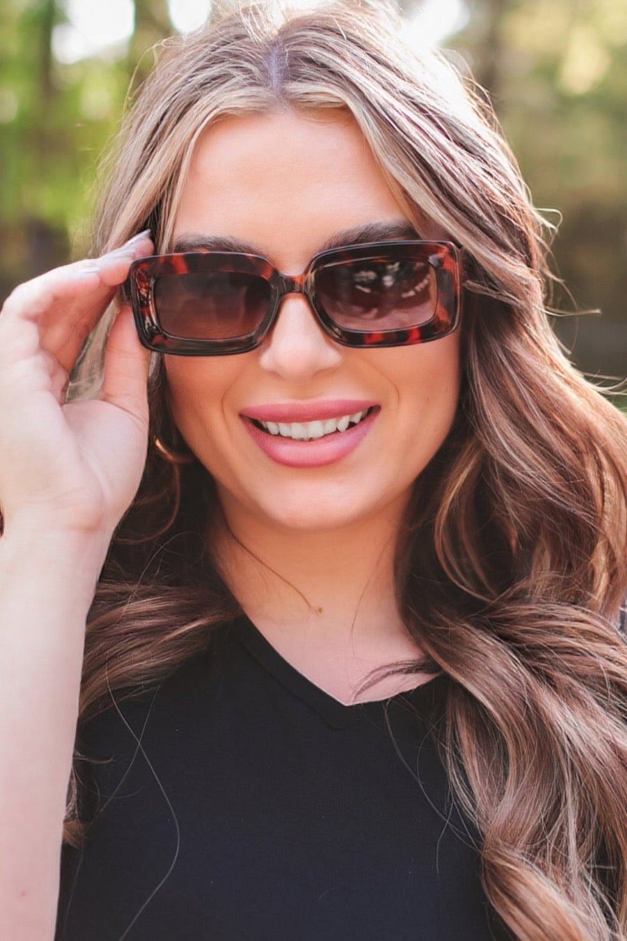 brown chunky rectangular sunglasses with thick frames, tinted lenses, smooth finish, UV protection, and brand detail (on both the temple and the complimentary black pouch)