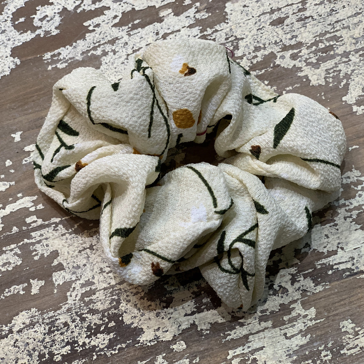 an oversized floral scrunchie with lightweight textured fabric, gathered construction, gentle hair-friendly hold, and easy pull-on styling in banana