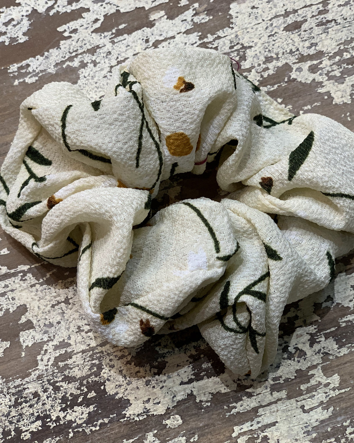 an oversized floral scrunchie with lightweight textured fabric, gathered construction, gentle hair-friendly hold, and easy pull-on styling in banana
