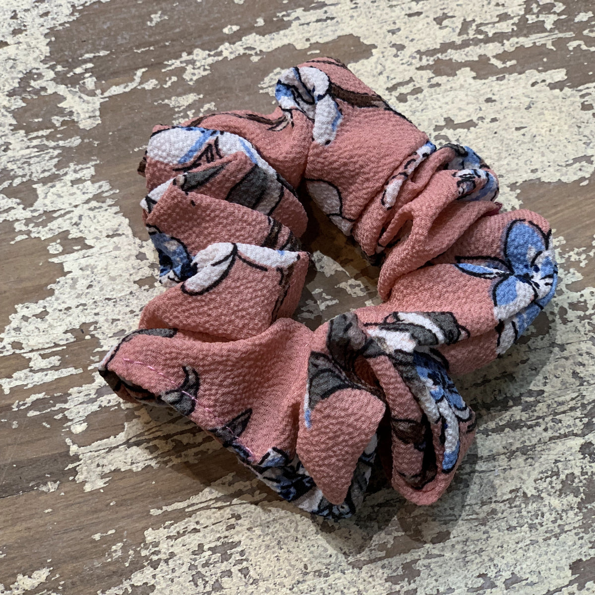 an oversized floral scrunchie with lightweight textured fabric, gathered construction, gentle hair-friendly hold, and easy pull-on styling in mauve