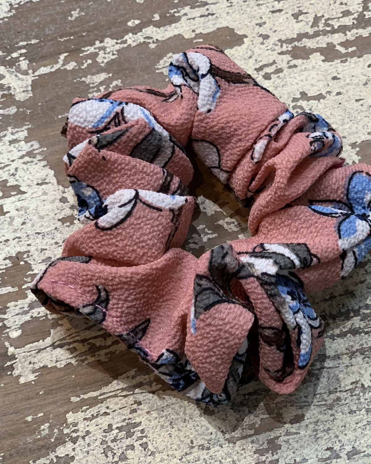 an oversized floral scrunchie with lightweight textured fabric, gathered construction, gentle hair-friendly hold, and easy pull-on styling in mauve
