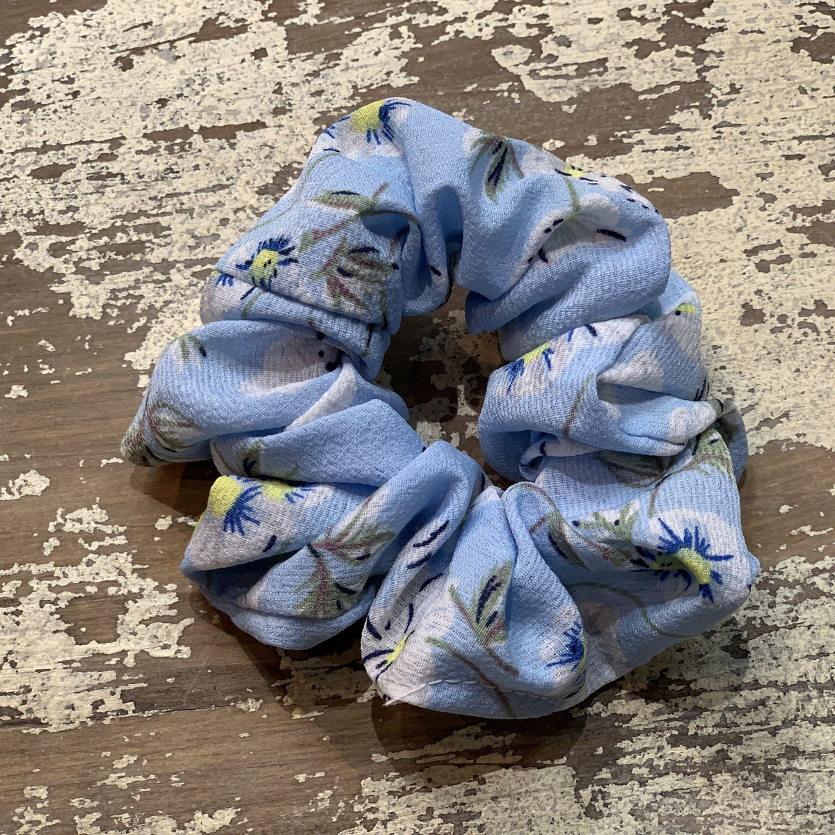 an oversized floral scrunchie with lightweight textured fabric, gathered construction, gentle hair-friendly hold, and easy pull-on styling in sky
