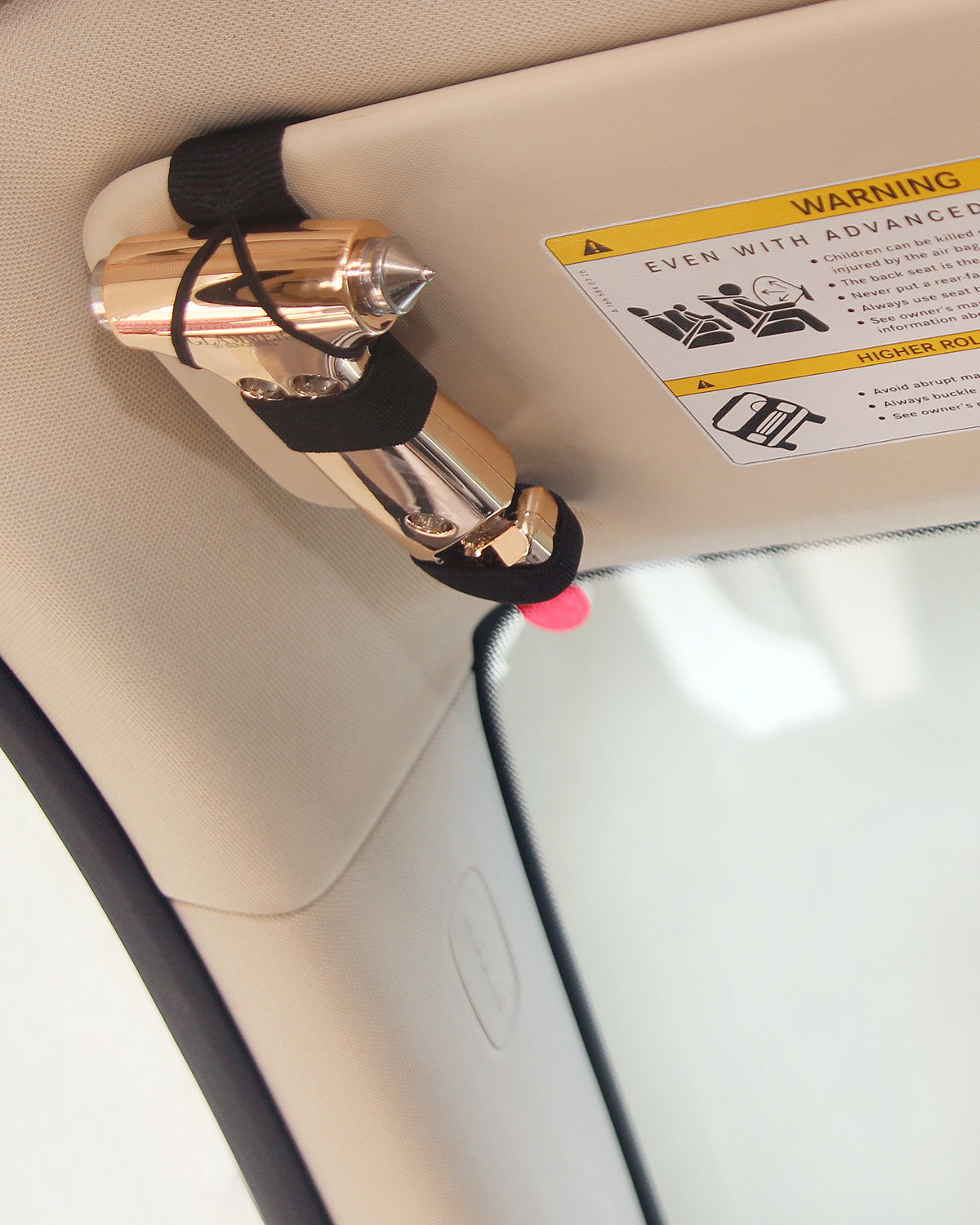 2-in-1 metallic escape hammer for the car with a velcro visor strap available in mint, pink, purple, rose gold, silver, and white