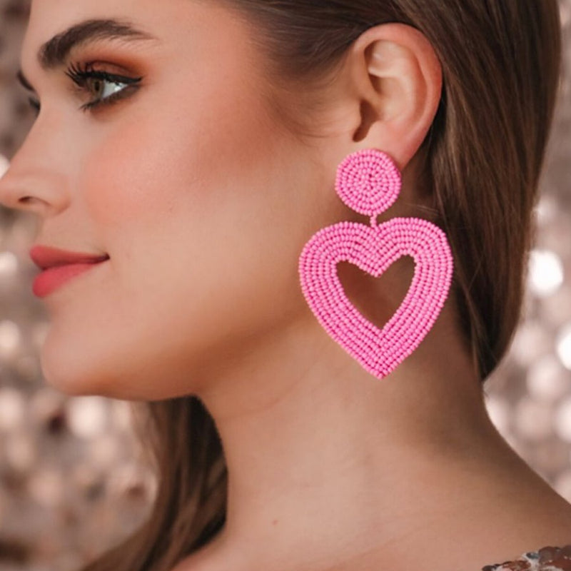 light pink beaded post stud earrings with matching beaded heart, a comfort replacement earring back, and a plastic disk stopper style in silver and gold