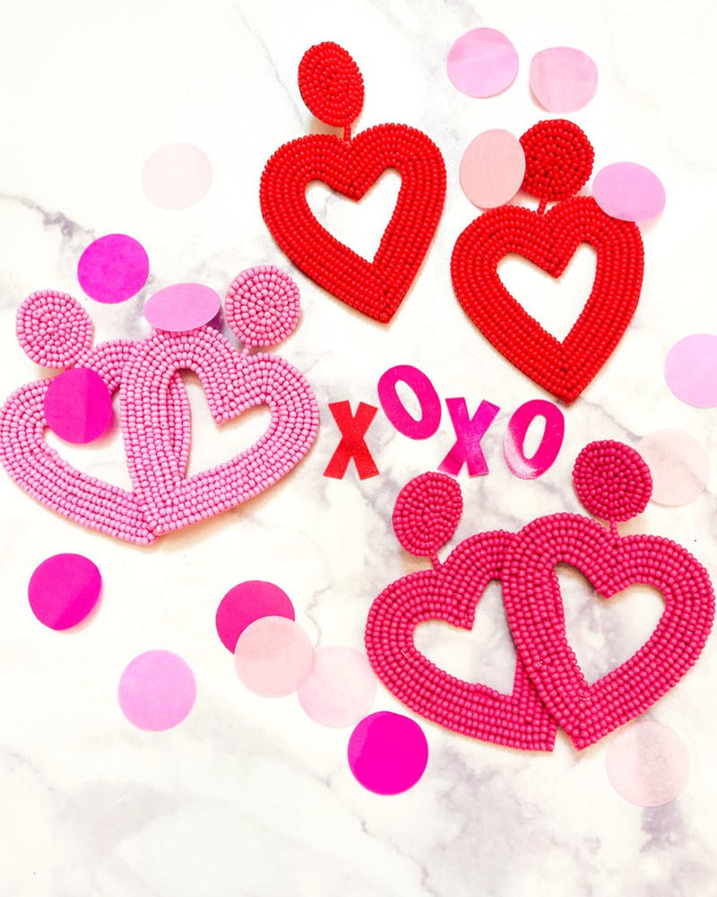 hot pink, light pink, and red beaded post stud earrings with matching beaded heart, a comfort replacement earring back, and a plastic disk stopper style in silver and gold