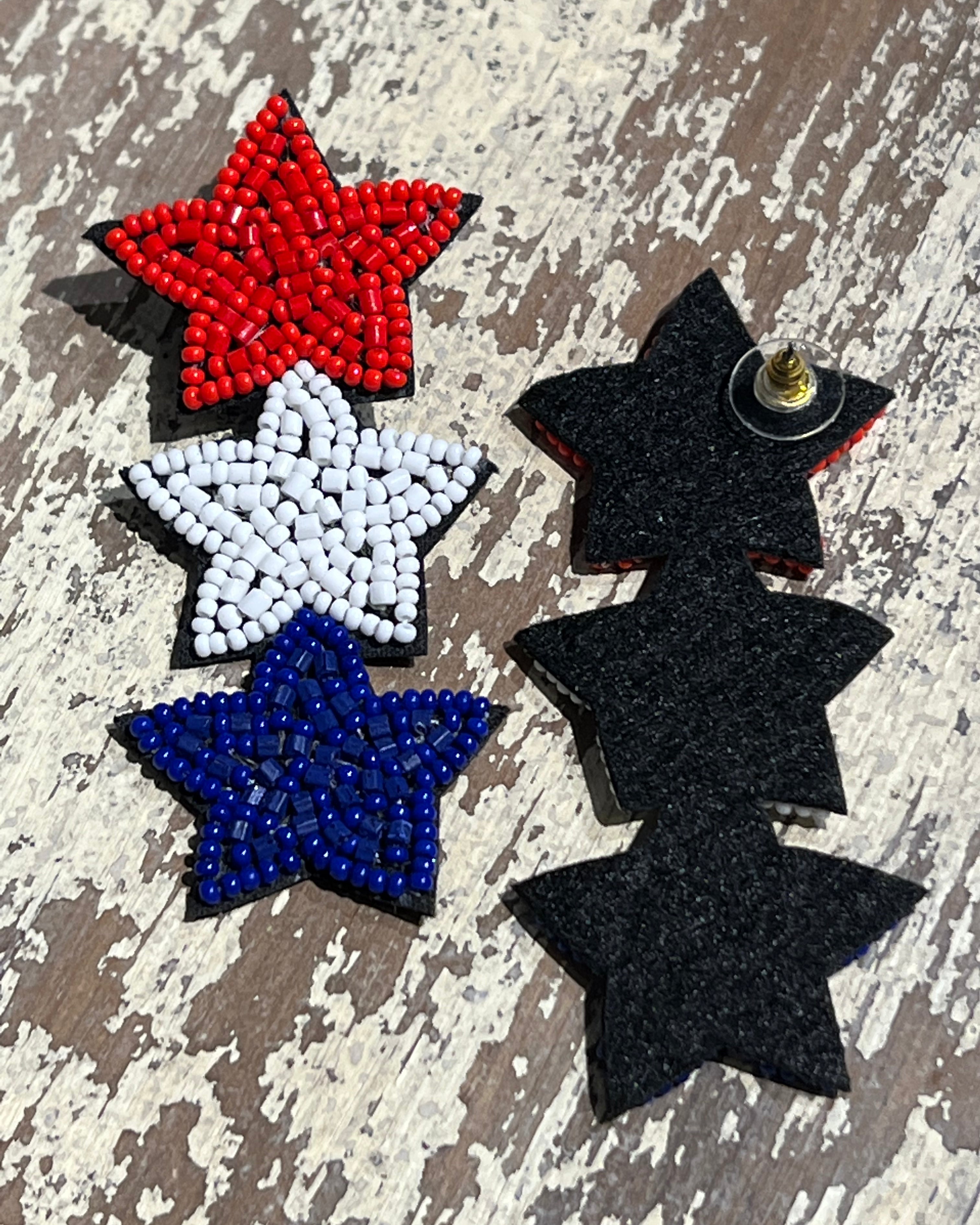 Americana-inspired beaded star earrings with red, white, and blue details, felt backing, and a push-back closure