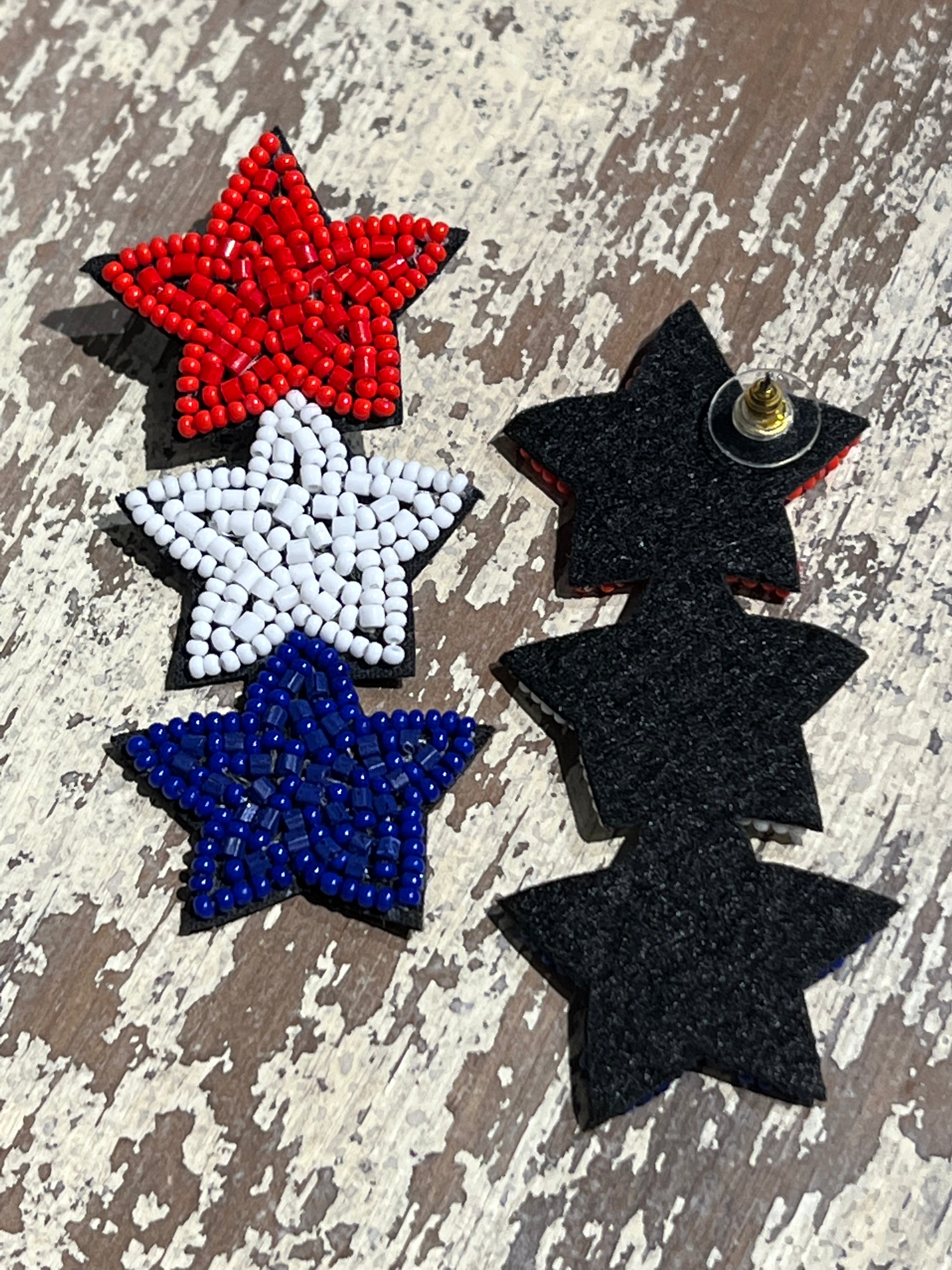 Americana-inspired beaded star earrings with red, white, and blue details, felt backing, and a push-back closure