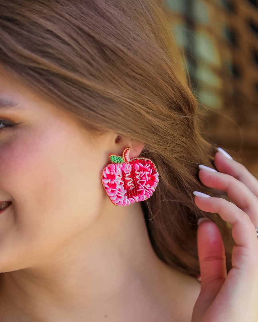 decorative apple shape stud earrings with a comfort back earring, a plastic disc stopper in gold, and a red felt back