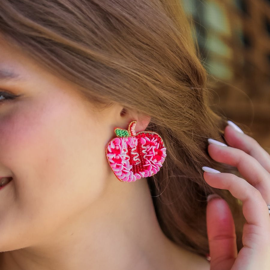 decorative apple shape stud earrings with a comfort back earring, a plastic disc stopper in gold, and a red felt back