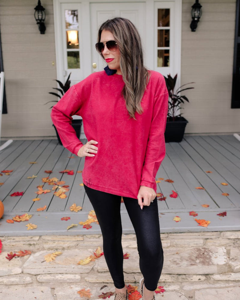 a long-sleeve ribbed textured pullover with a crew neck collar, a vintage wash, and a relaxed fit in red