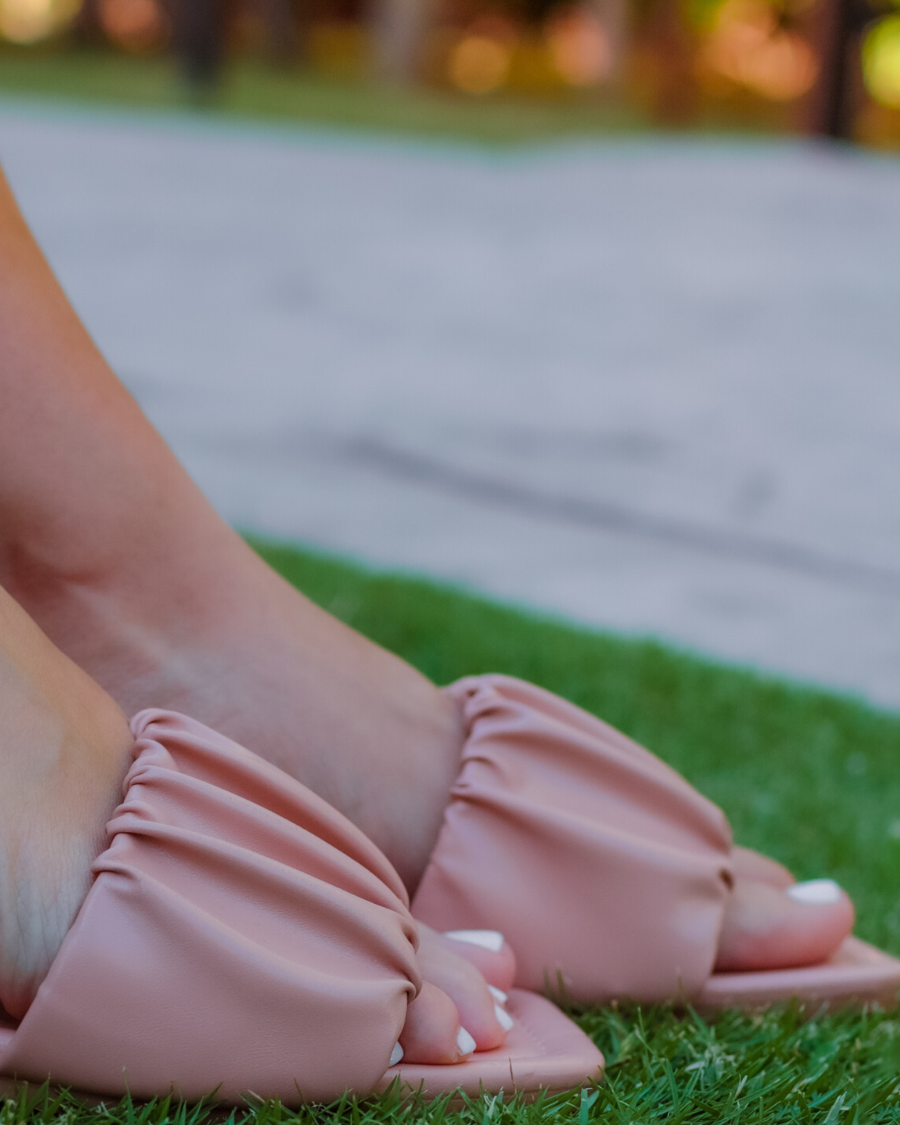 ruched slip-on sandals with an open toe and flat sole in neutral