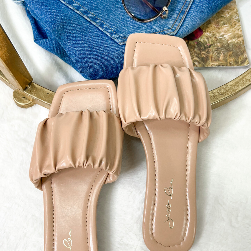 ruched slip-on sandals with an open toe and flat sole in neutral