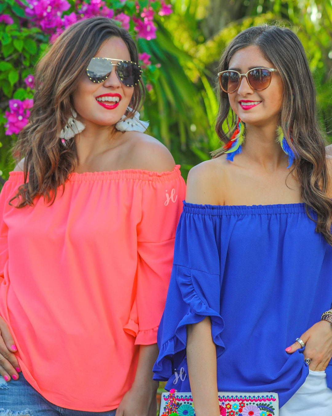 a flowy style top with a gathered scoop neckline that can be worn on or off the shoulder and three-quarter split ruffle sleeves in blue and coral