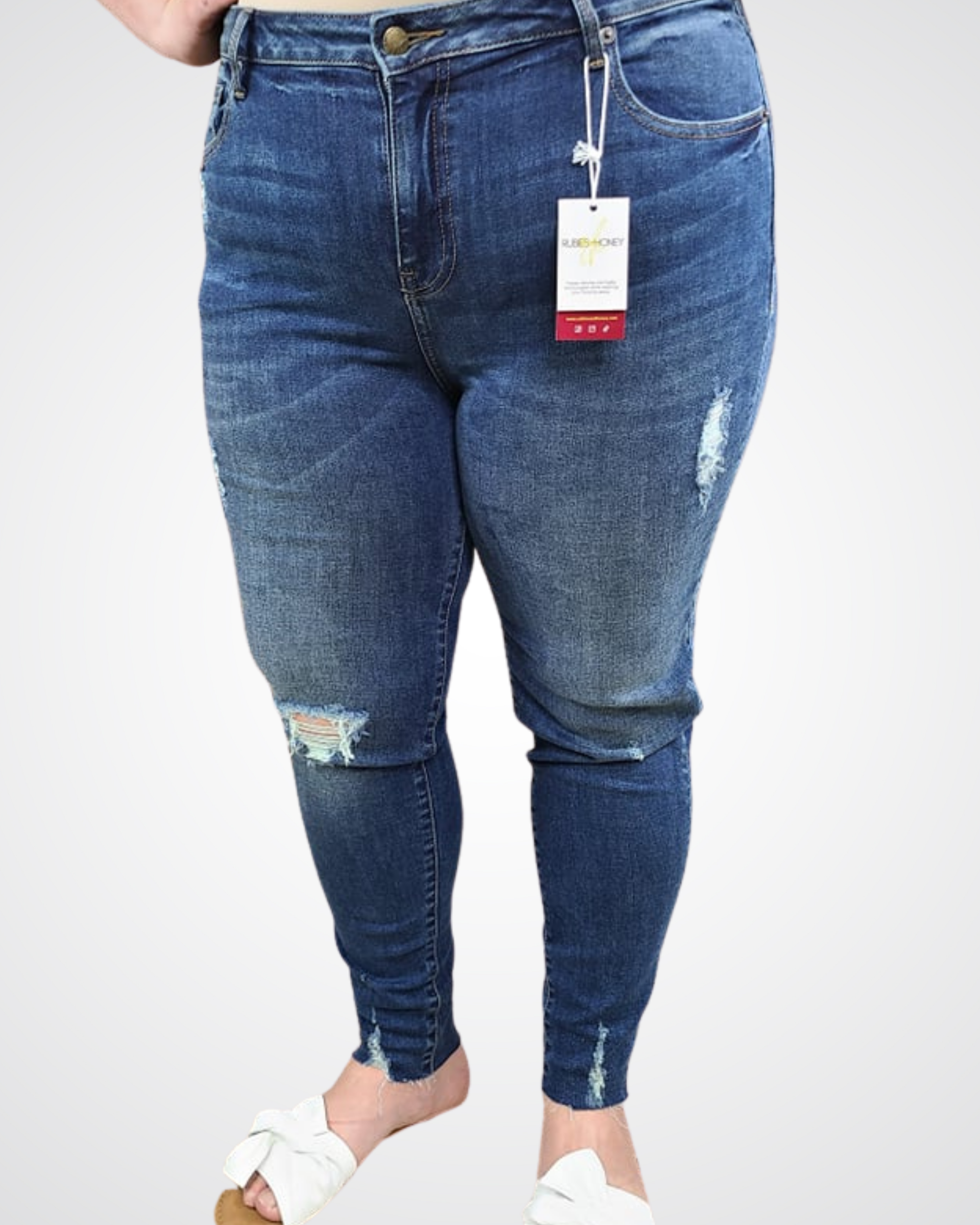 mid-rise distressed ankle skinny jeans made of Lycra® Beauty denim with a zip button-up fly and pockets