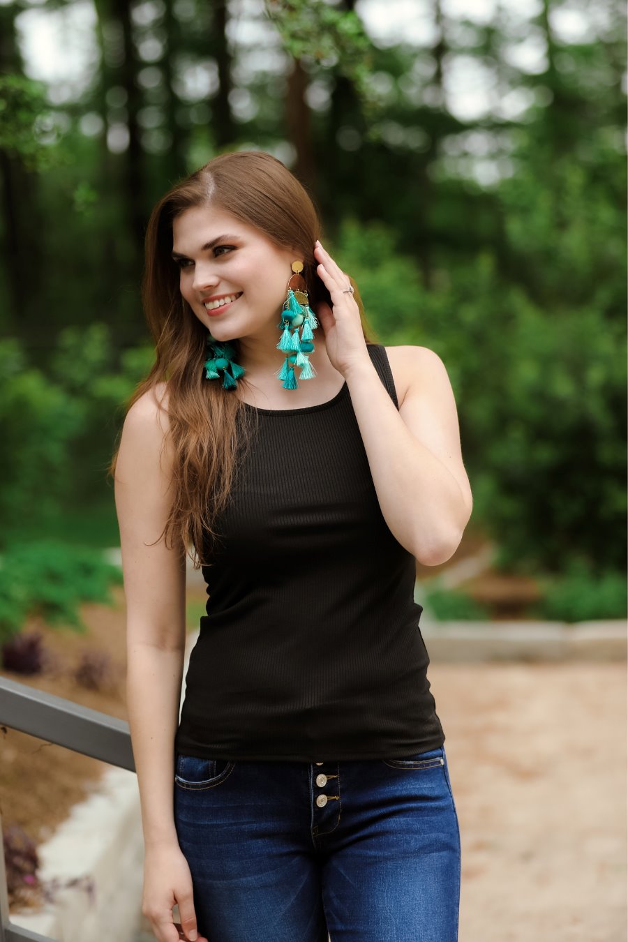 a black sleeveless tank top made of stretchy ribbed fabric