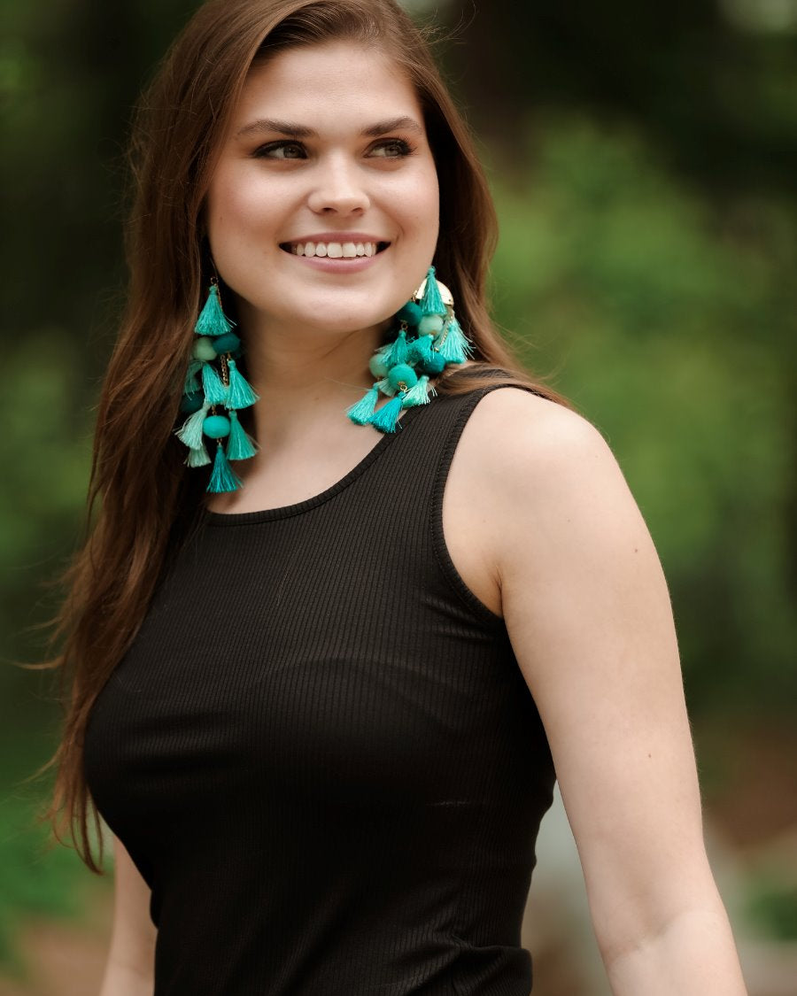 a black sleeveless tank top made of stretchy ribbed fabric