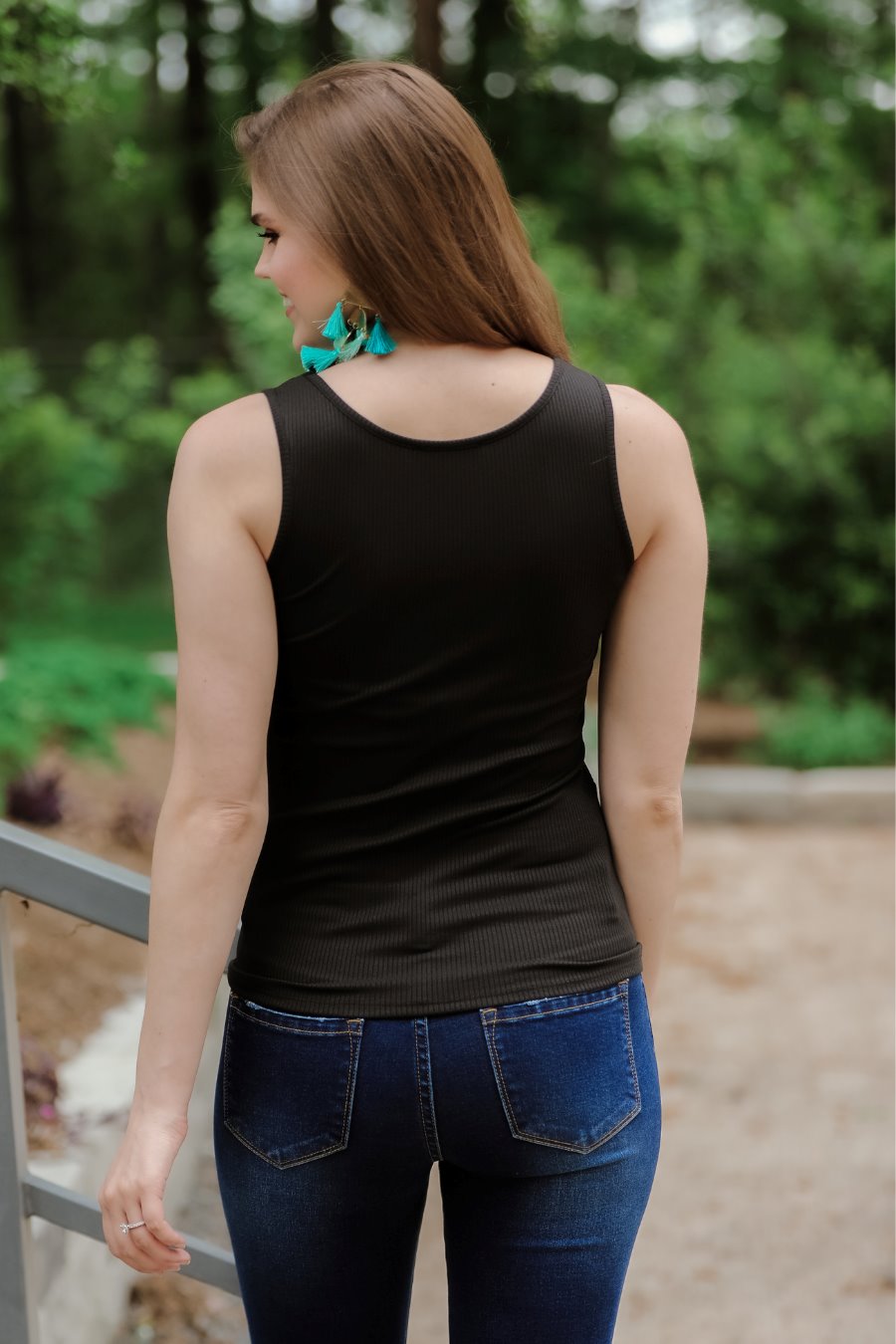 a black sleeveless tank top made of stretchy ribbed fabric