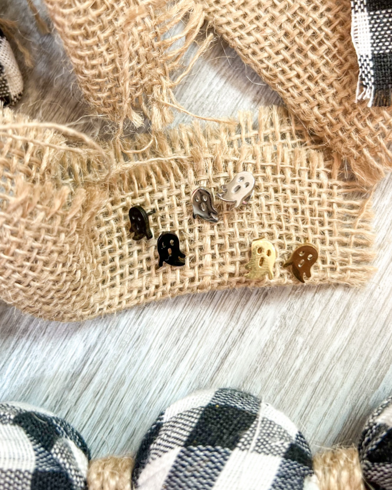 lightweight stainless steel, gold-plated post-stud earrings with shiny mirror-image ghost silhouettes, matching barrel earring backs, and nickel/lead compliant construction in black, gold, and silver