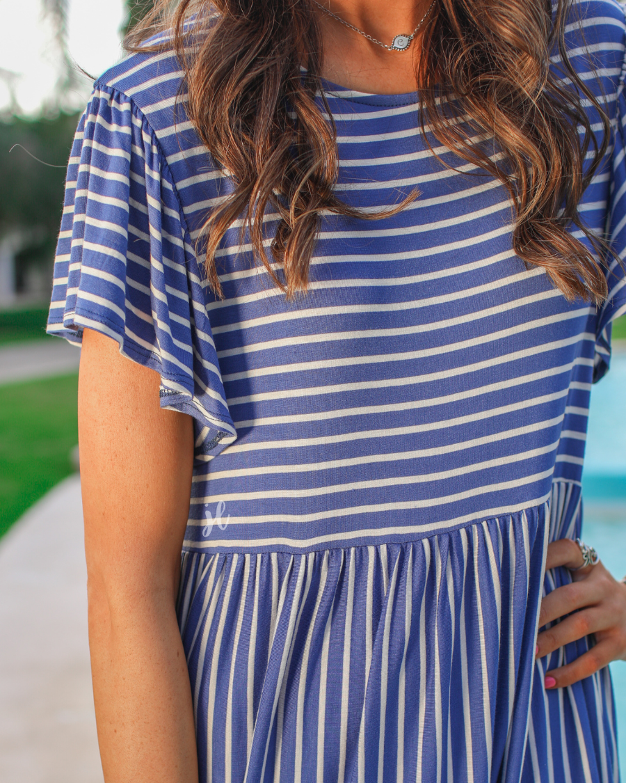 short ruffled sleeves dress with a round neckline, material with a generous amount of stretch, a babydoll fit, and no lining in blue