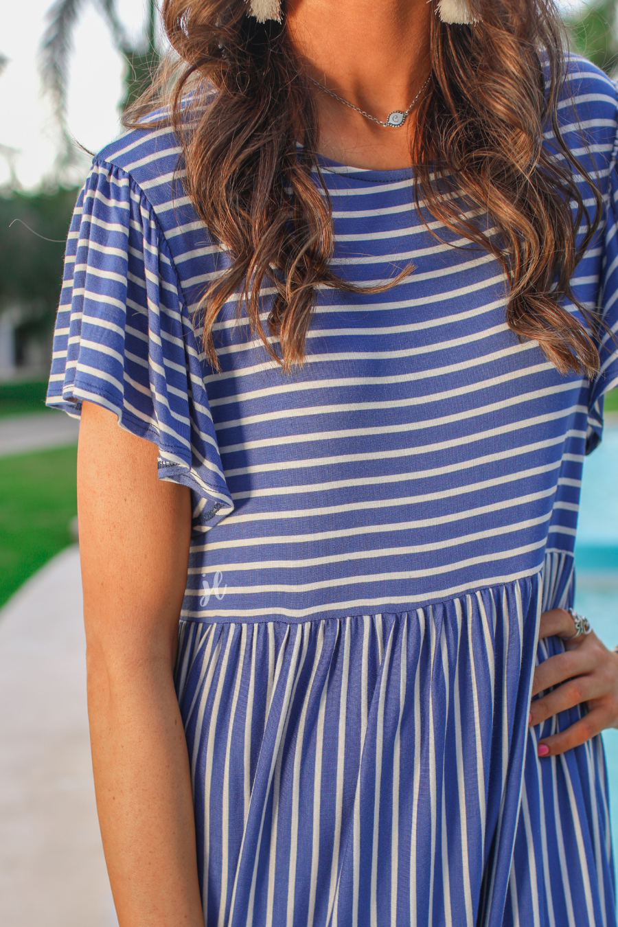 short ruffled sleeves dress with a round neckline, material with a generous amount of stretch, a babydoll fit, and no lining in blue