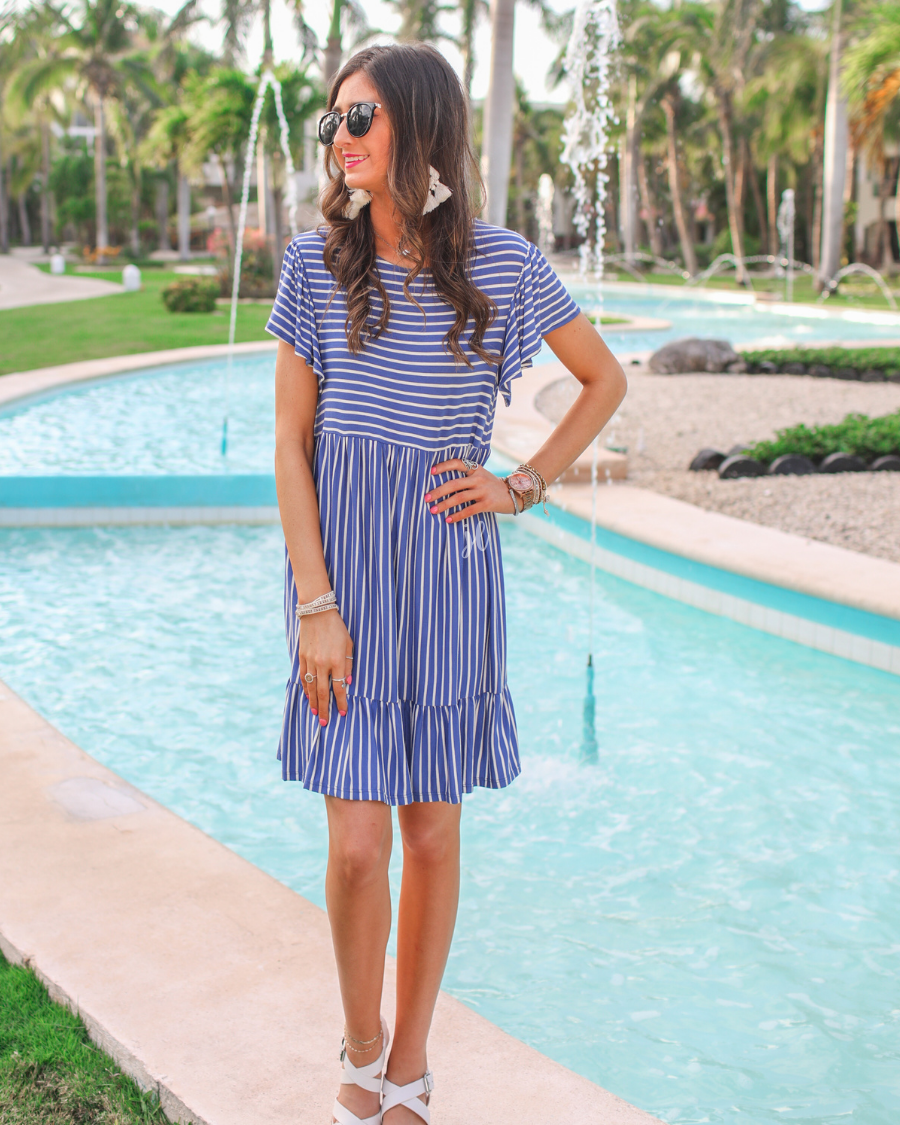 short ruffled sleeves dress with a round neckline, material with a generous amount of stretch, a babydoll fit, and no lining in blue