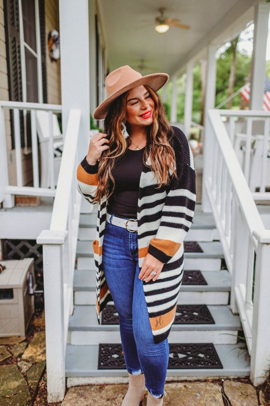 long-sleeve open front relaxed fit cardigan crafted from ultra soft, luxe knit with pockets on a black, caramel, and ivory stripe fabric