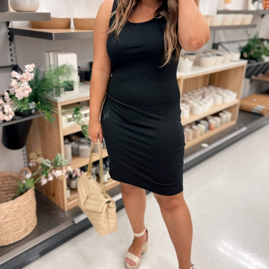 a lightweight midi bodycon dress with a flattering ribbed knit, a sleeveless silhouette, and a scoop neckline fabric in black