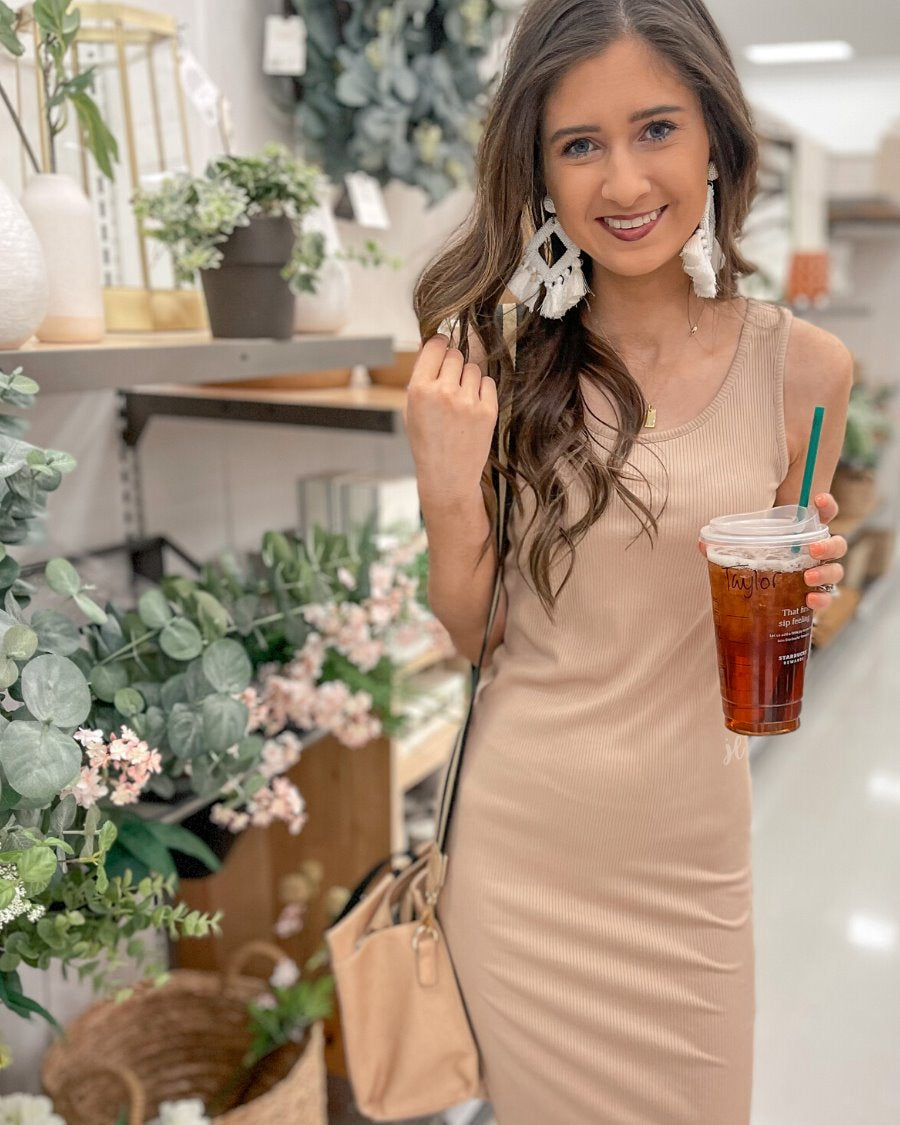 a lightweight midi bodycon dress with a flattering ribbed knit, a sleeveless silhouette, and a scoop neckline fabric in taupe