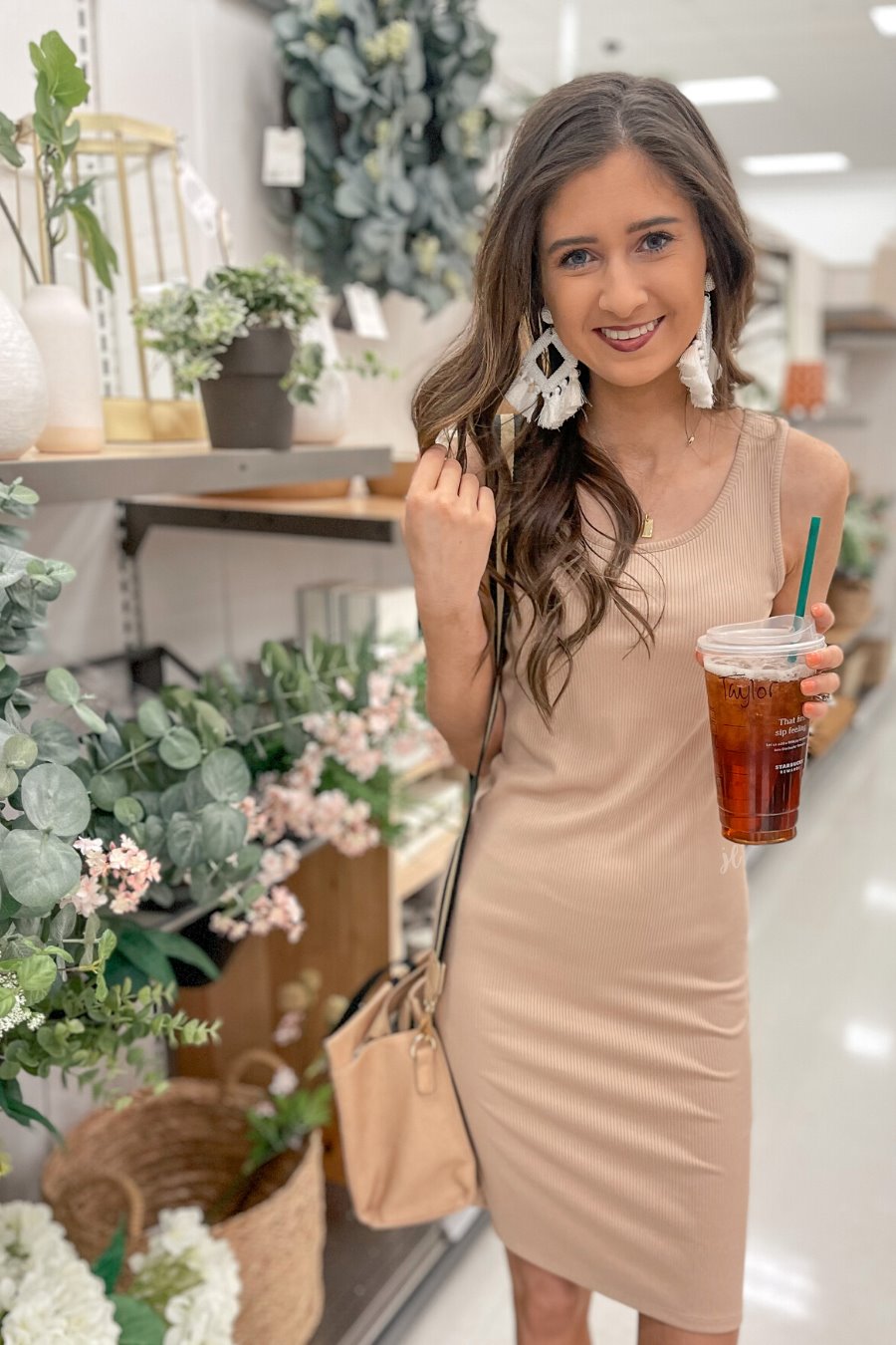 a lightweight midi bodycon dress with a flattering ribbed knit, a sleeveless silhouette, and a scoop neckline fabric in taupe