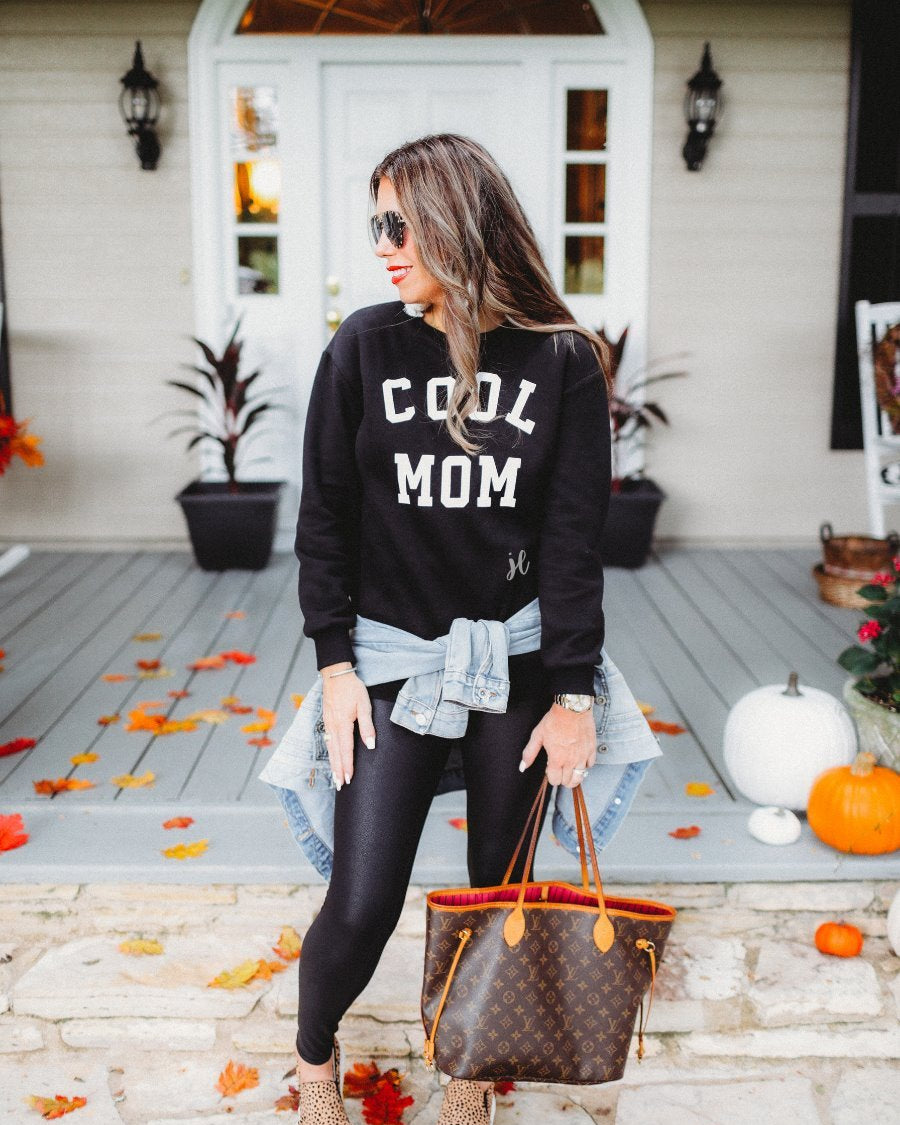 long-sleeve sweatshirt with ultra soft fleece interior, a crew neckline, and bold white 'COOL MOM' block lettering