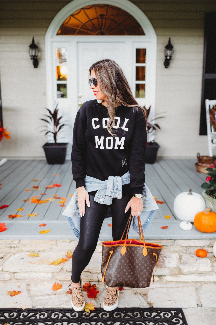 long-sleeve sweatshirt with ultra soft fleece interior, a crew neckline, and bold white 'COOL MOM' block lettering