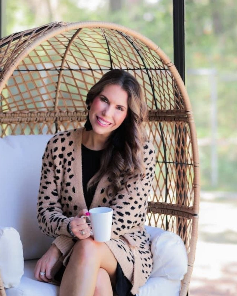 long sleeve wrap robe patterned with animal print, a straight mid-thigh length hemline, and a relaxed open front silhouette with a belt closure made of super soft material in brown spotted pattern