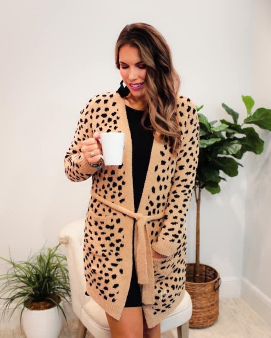 long sleeve wrap robe patterned with animal print, a straight mid-thigh length hemline, and a relaxed open front silhouette with a belt closure made of super soft material in brown spotted pattern