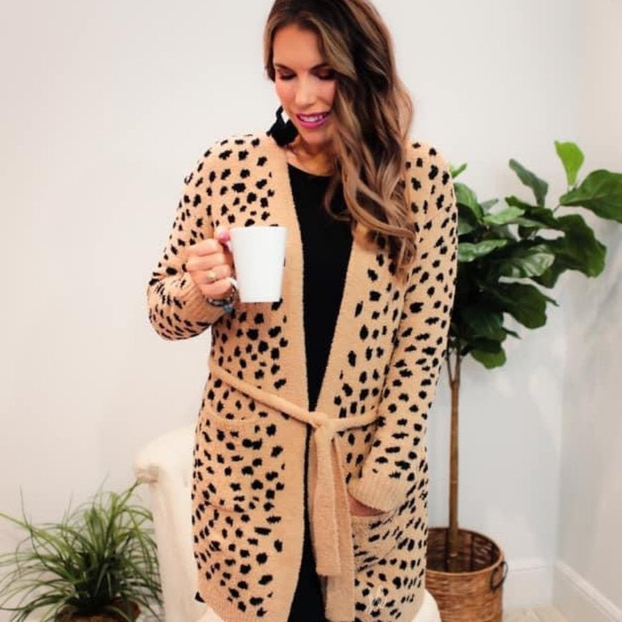 long sleeve wrap robe patterned with animal print, a straight mid-thigh length hemline, and a relaxed open front silhouette with a belt closure made of super soft material in brown spotted pattern