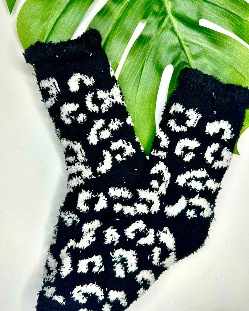 ultra-soft fuzzy socks with a playful animal print in black