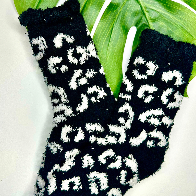 ultra-soft fuzzy socks with a playful animal print in black